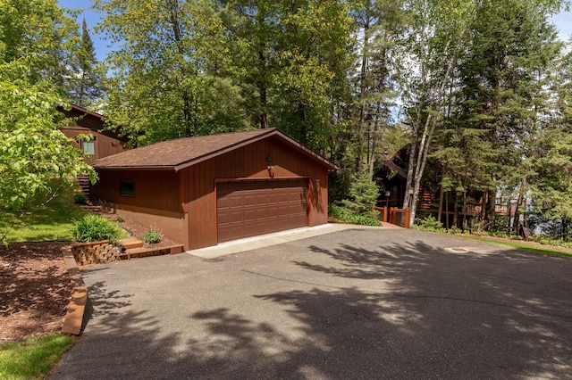 31690 Large Pine Trl, Laporte, MN 56461 - view of front of house with a detached garage, an outdoor structure, and a shingled roof
