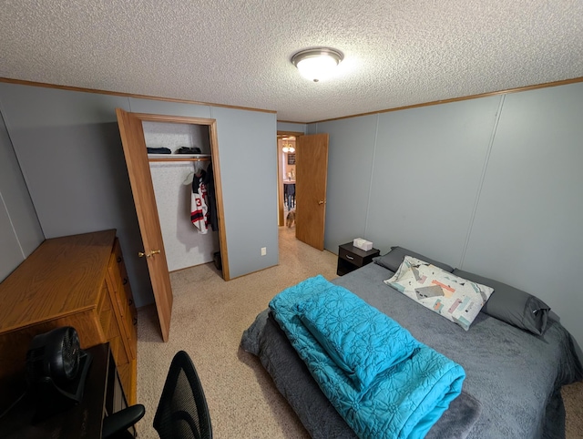 bedroom with carpet flooring, a textured ceiling, and ornamental molding