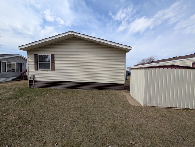 view of home's exterior with a lawn