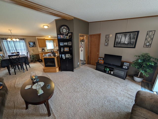 living area featuring ornamental molding, a notable chandelier, light colored carpet, and a textured ceiling