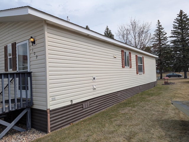 view of property exterior with a lawn
