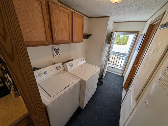 laundry area featuring separate washer and dryer, dark colored carpet, ornamental molding, and cabinet space