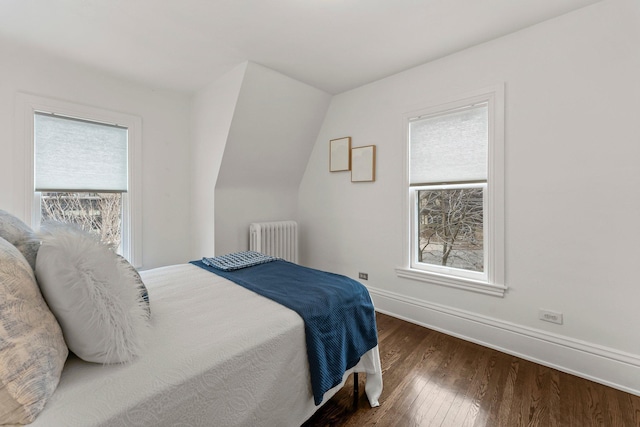 4001 Sheridan Ave S, Minneapolis, MN 55410 - bedroom with radiator heating unit, multiple windows, wood finished floors, and baseboards