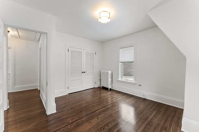 4001 Sheridan Ave S, Minneapolis, MN 55410 - additional living space featuring radiator heating unit, attic access, dark wood finished floors, and baseboards