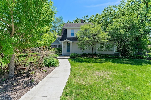 4001 Sheridan Ave S, Minneapolis, MN 55410 - obstructed view of property with a chimney and a front yard