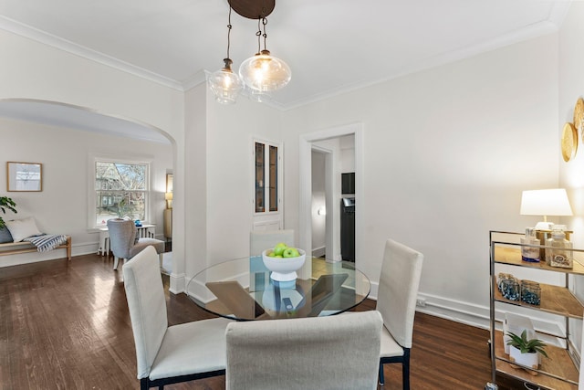 4001 Sheridan Ave S, Minneapolis, MN 55410 - dining room featuring arched walkways, crown molding, wood finished floors, and baseboards