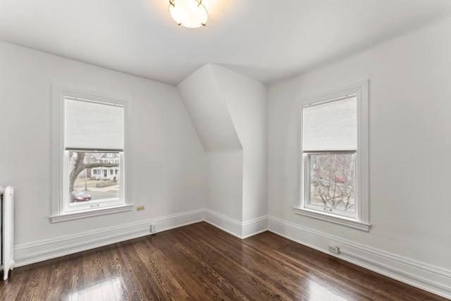 4001 Sheridan Ave S, Minneapolis, MN 55410 - bonus room featuring dark wood-type flooring, baseboards, and radiator heating unit