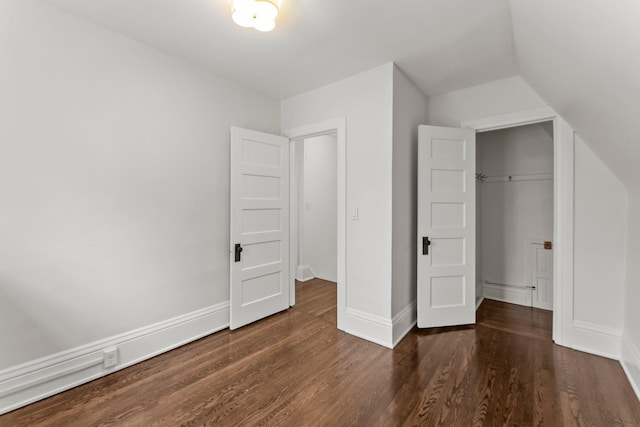 4001 Sheridan Ave S, Minneapolis, MN 55410 - unfurnished bedroom featuring dark wood-style flooring, baseboards, and lofted ceiling