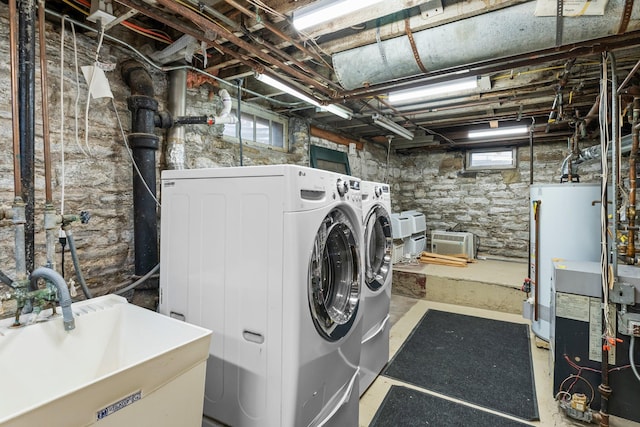 4001 Sheridan Ave S, Minneapolis, MN 55410 - laundry area featuring washer and clothes dryer and water heater
