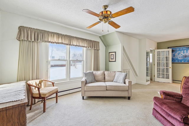 carpeted living room featuring a ceiling fan, a baseboard heating unit, and a textured ceiling