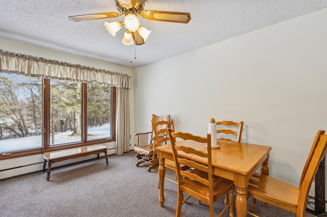 dining area with a textured ceiling, a baseboard heating unit, carpet flooring, and ceiling fan