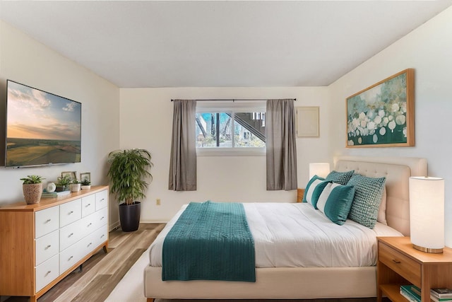 bedroom featuring wood finished floors