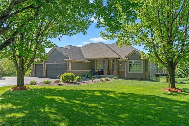 15210 Painters Lane Cir N, West Lakeland Twp, MN 55082 - view of front of home with concrete driveway, stone siding, a garage, and a front yard