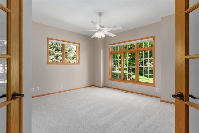 15210 Painters Lane Cir N, West Lakeland Twp, MN 55082 - carpeted empty room featuring healthy amount of natural light, baseboards, and ceiling fan