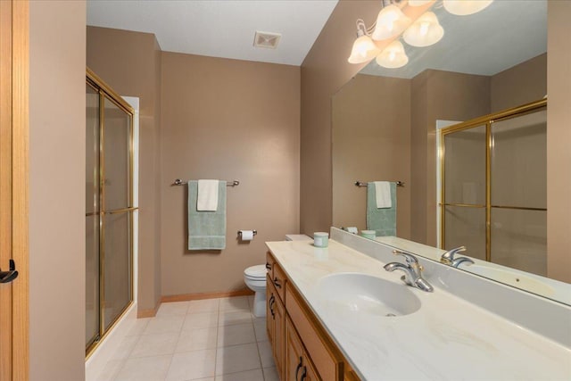 15210 Painters Lane Cir N, West Lakeland Twp, MN 55082 - full bathroom featuring a shower stall, toilet, vanity, baseboards, and tile patterned flooring