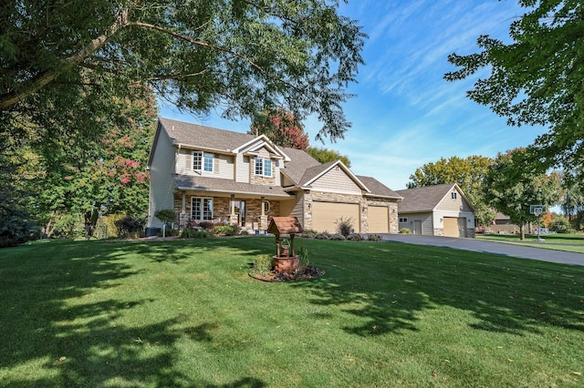 view of front of property with driveway, stone siding, a front lawn, and a garage