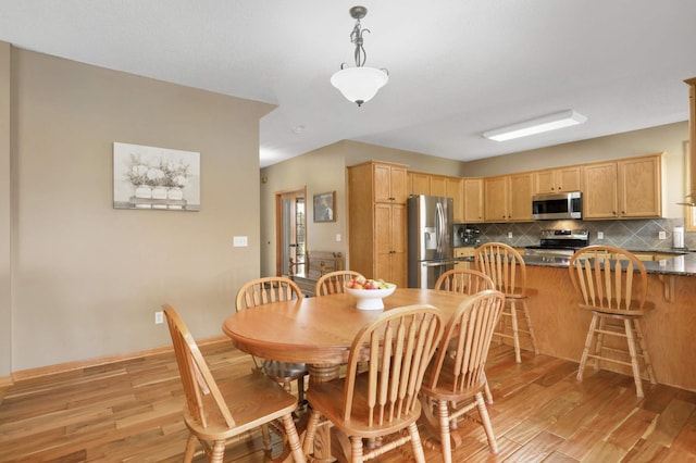 dining room featuring light wood-style flooring