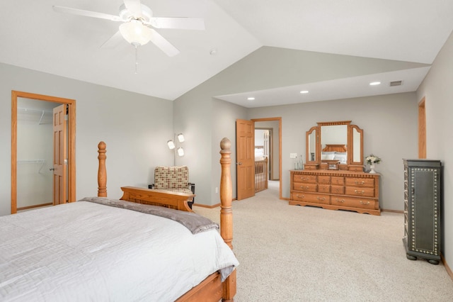 carpeted bedroom with recessed lighting, ceiling fan, visible vents, vaulted ceiling, and a spacious closet