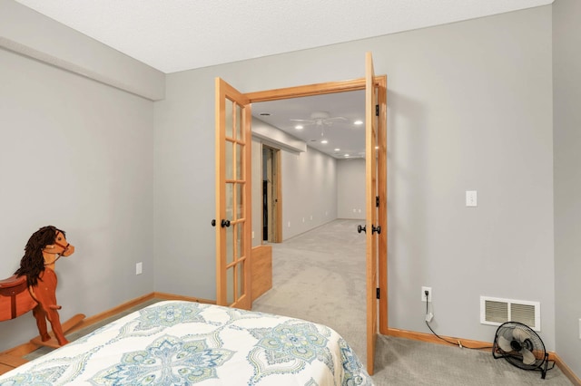 bedroom featuring recessed lighting, carpet, baseboards, visible vents, and french doors