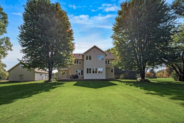 rear view of house with a lawn