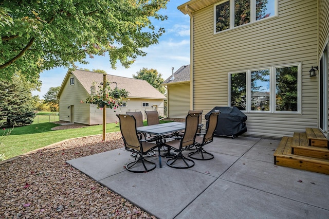 view of patio with fence, outdoor dining area, and grilling area