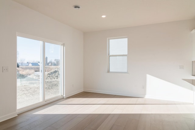 10037 73rd Ln NE, Otsego, MN 55330 - spare room with wood finished floors, baseboards, and recessed lighting