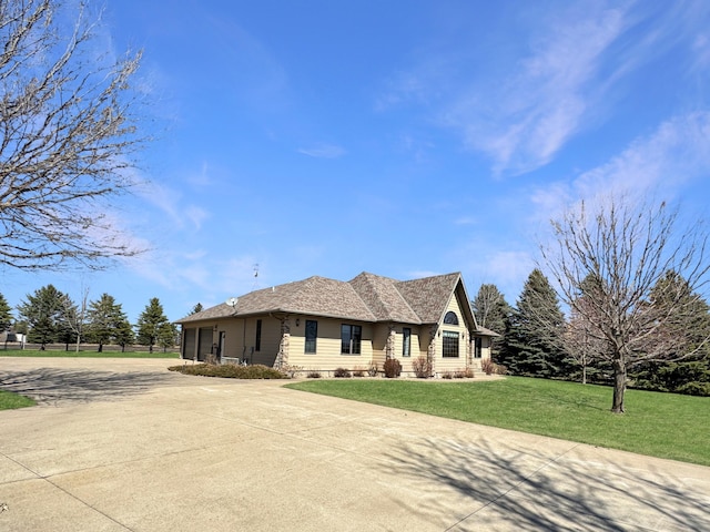 ranch-style home featuring a front yard, driveway, and crawl space