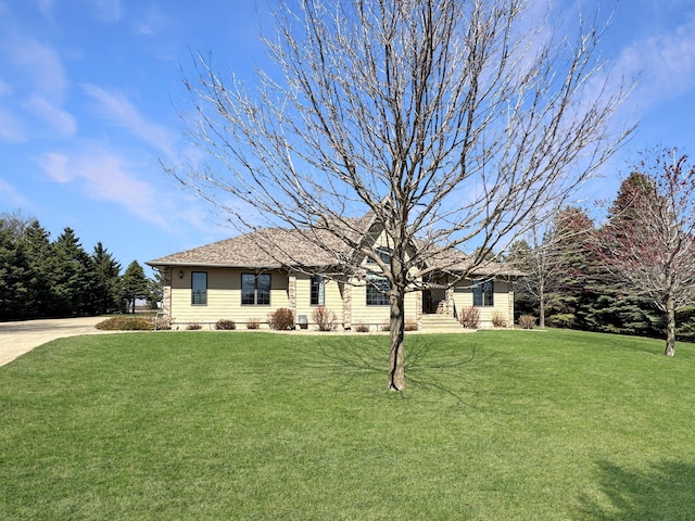 ranch-style home with roof with shingles, crawl space, and a front lawn
