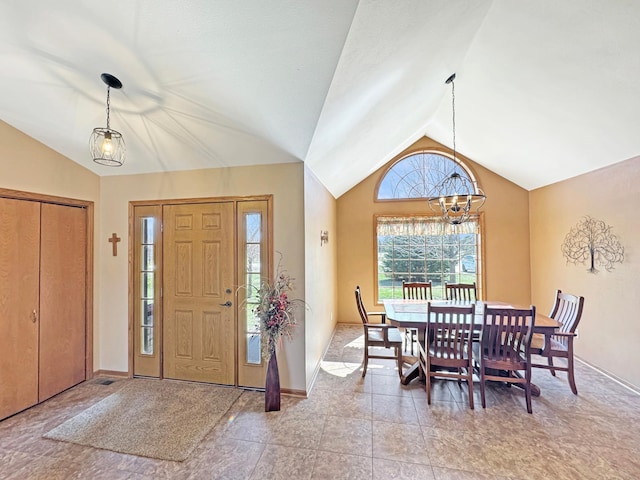 entrance foyer featuring vaulted ceiling, baseboards, and a chandelier