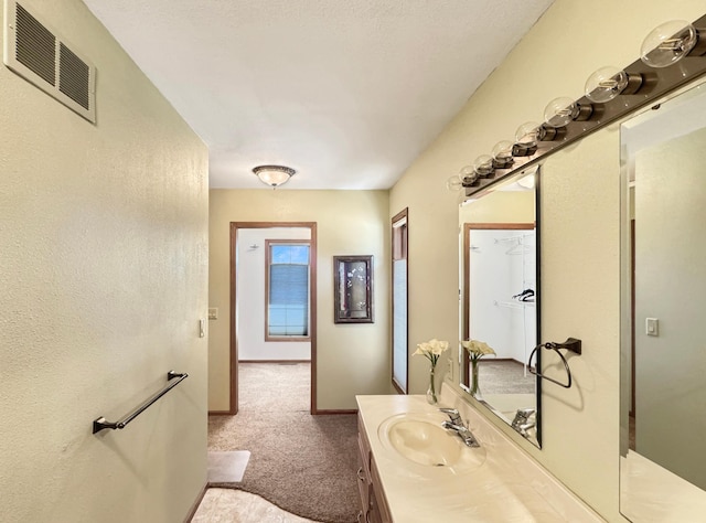 bathroom featuring visible vents and vanity