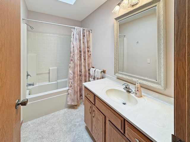 full bathroom with a skylight, vanity, and shower / bathtub combination with curtain