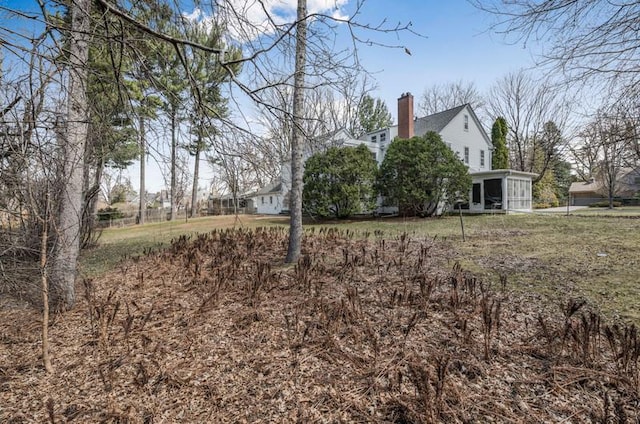 view of yard with a sunroom