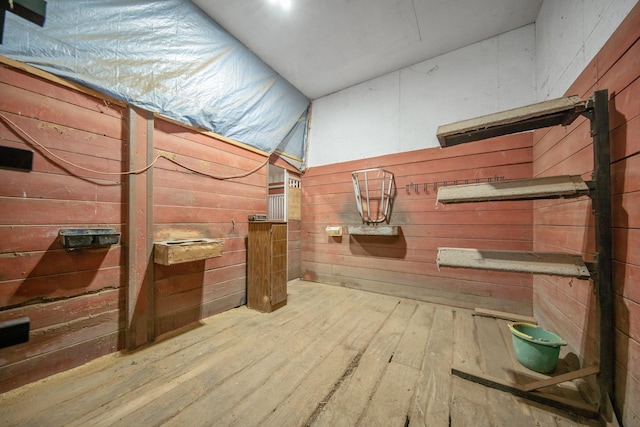 12446 190th St, Page Twp, MN 56353 - bathroom featuring hardwood / wood-style flooring and wooden walls