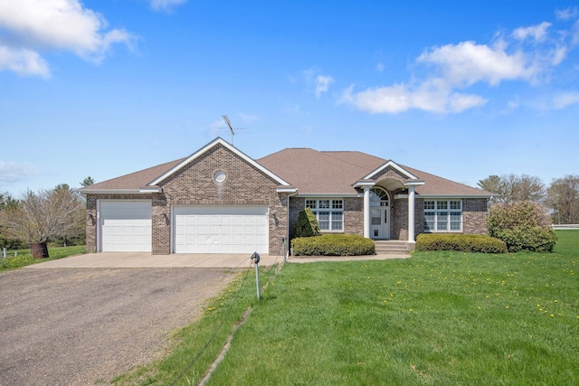 12446 190th St, Page Twp, MN 56353 - ranch-style house with driveway, a front yard, an attached garage, and brick siding