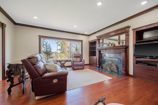 12446 190th St, Page Twp, MN 56353 - living room with a high end fireplace, wood finished floors, ornamental molding, and recessed lighting