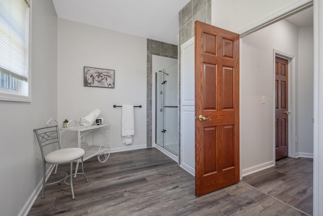 12446 190th St, Page Twp, MN 56353 - full bathroom with a stall shower and wood finished floors