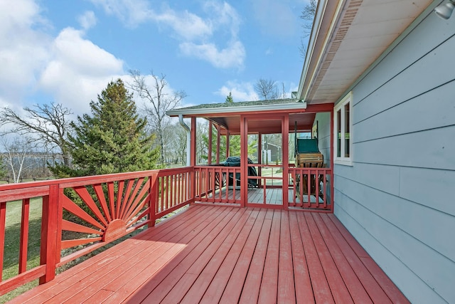 deck with a sunroom