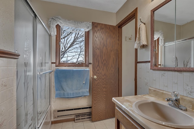 bathroom featuring a baseboard heating unit, a shower with door, decorative backsplash, tile patterned flooring, and vanity