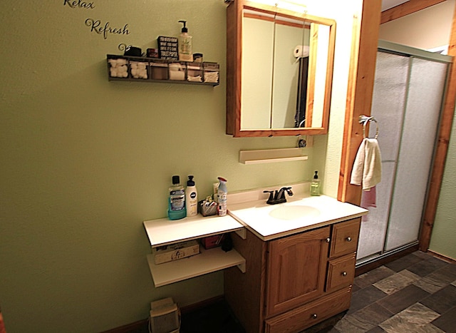 bathroom with vanity and a stall shower