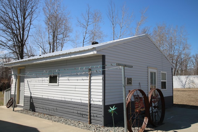 view of side of property with fence