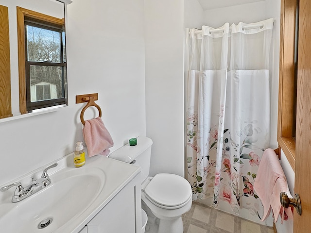 bathroom featuring tile patterned floors, vanity, a shower with shower curtain, and toilet