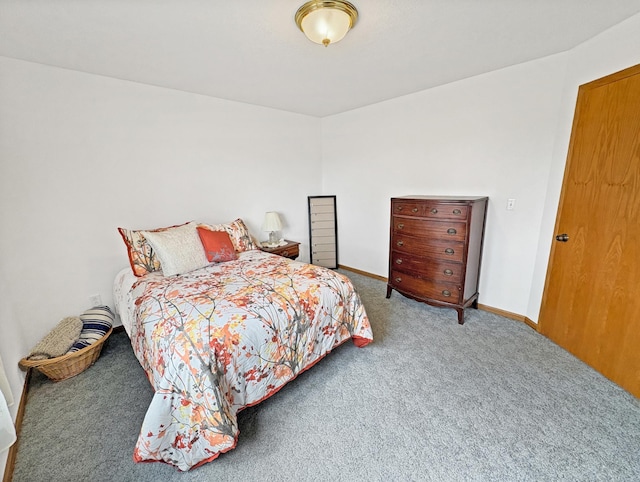 bedroom with baseboards and carpet flooring