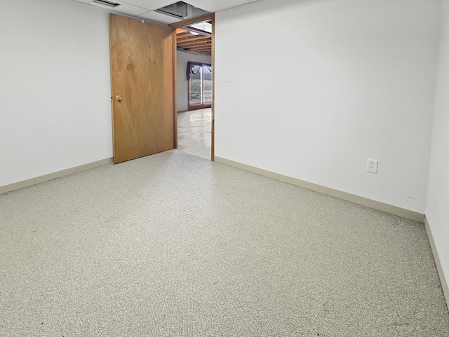 empty room featuring visible vents and baseboards