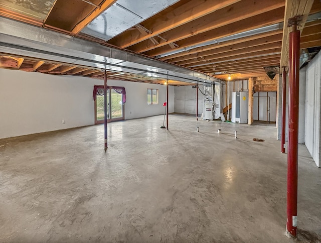 below grade area featuring water heater and heating unit