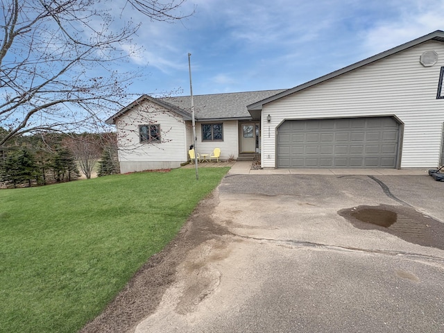 view of front facade featuring a front lawn, driveway, roof with shingles, and a garage