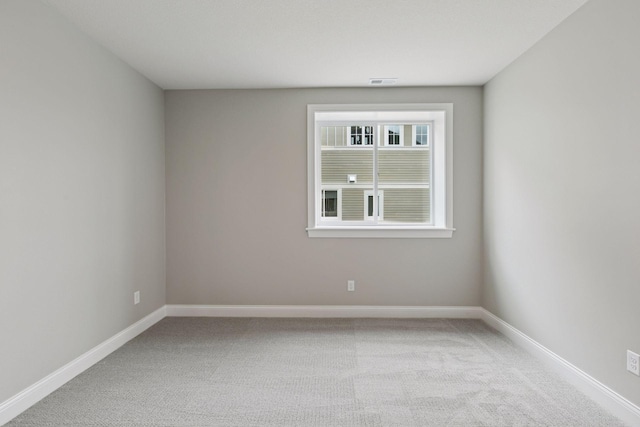 1571 Marsh Pointe Ct, Medina, MN 55340 - empty room featuring visible vents, baseboards, and light colored carpet