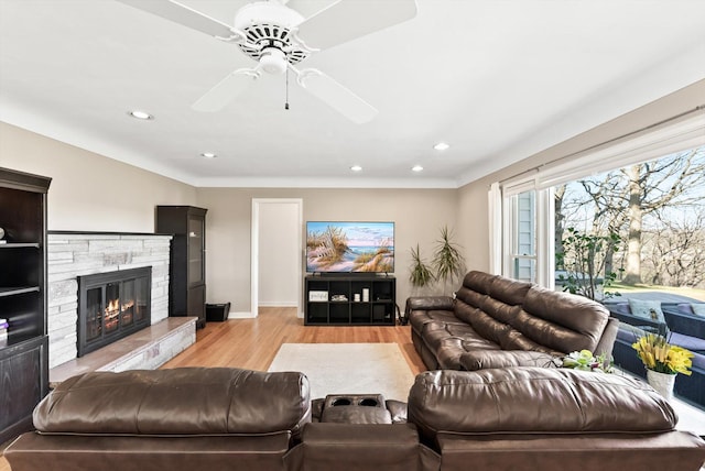 312 Walnut St, Taylors Falls, MN 55084 - living area featuring light wood-style floors, ceiling fan, a fireplace, recessed lighting, and baseboards
