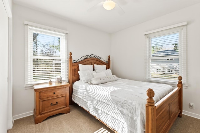 312 Walnut St, Taylors Falls, MN 55084 - bedroom with light colored carpet, baseboards, and ceiling fan