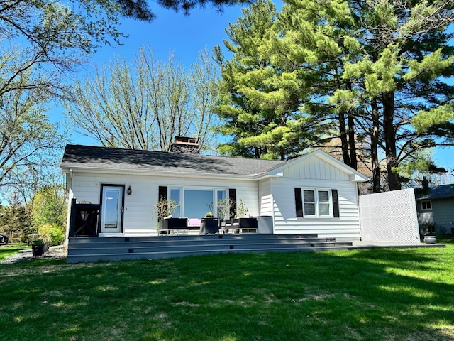 312 Walnut St, Taylors Falls, MN 55084 - back of property with a yard and a chimney