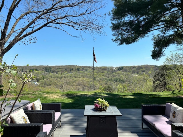 312 Walnut St, Taylors Falls, MN 55084 - wooden deck with a view of trees, outdoor lounge area, and a lawn